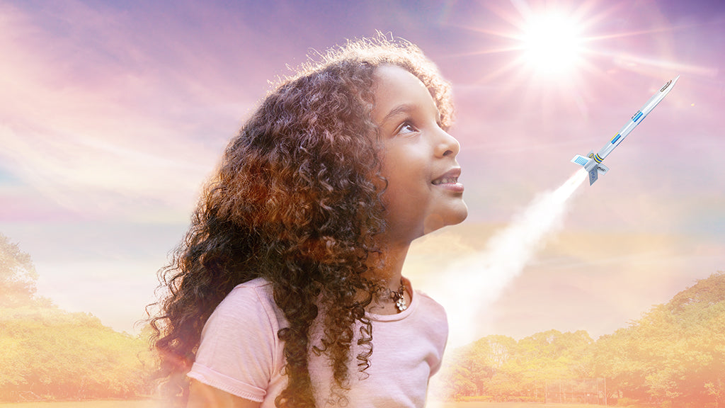 Young girl watching rocket launch