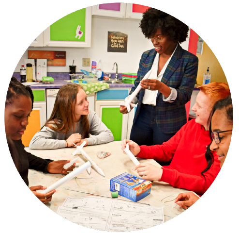 Teacher and students with model rocket lesson plan 