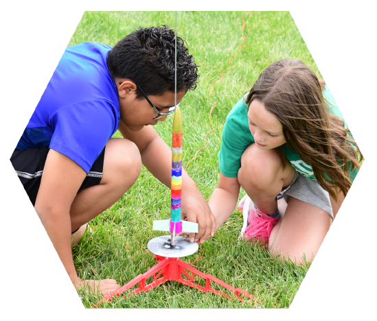 Young children launching Estes model rocket 